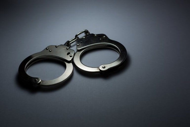 handcuffs arrested drugs dealer